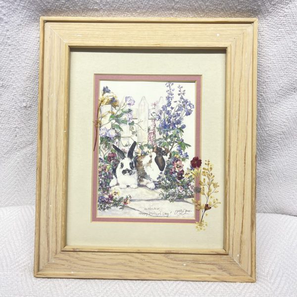 Picture of rabbits and flowers in a frame