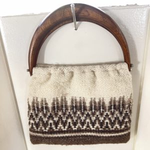 Brown and white handbag with wood handle